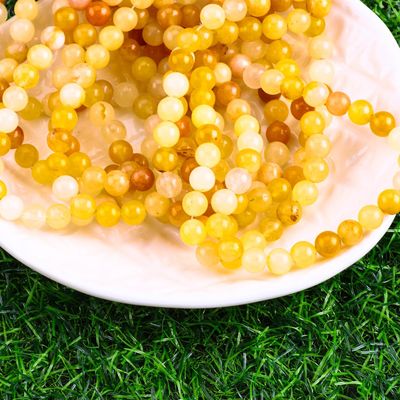 رنگ زرد تیره ژاد گرد گنجی کریستال طبیعی سنگ قیمتی اندازه گنجی مختلف رشته های گنجی گنجی برای ساخت جواهرات DIY