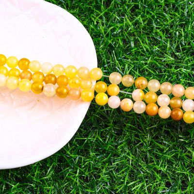 رنگ زرد تیره ژاد گرد گنجی کریستال طبیعی سنگ قیمتی اندازه گنجی مختلف رشته های گنجی گنجی برای ساخت جواهرات DIY