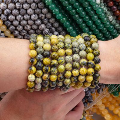 سنگ قیمتی پولیش شده 6mm 8mm گره های زرد Howlite برای ساخت صنایع دستی