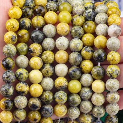 سنگ قیمتی پولیش شده 6mm 8mm گره های زرد Howlite برای ساخت صنایع دستی