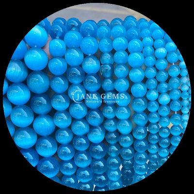 قرمز آبی بنفش رنگارنگ موهایی شکل گرد چشم گربه رشته های موهایی گشاده برای انرژی درمانی و هدیه دادن