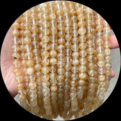 سنگ قیمتی پولیش گرد برش آتش کوارتز طلایی Rutilated کوارتز رشته های گنجی برای ساخت جواهرات DIY